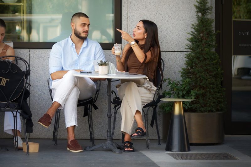Young couple at a terrace table